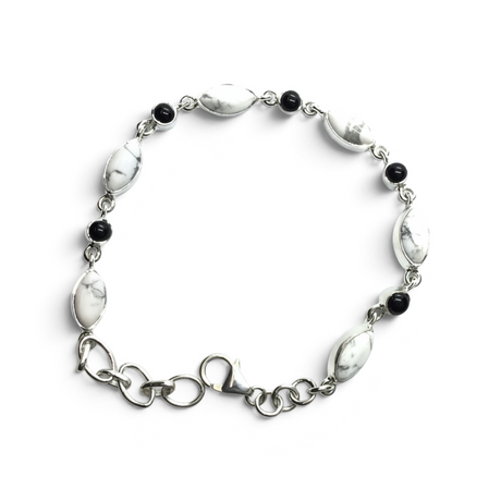 Rare Earth Gallery link bracelet featuring oval howlite and round black onyx cabochons set in 925 sterling silver.