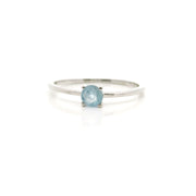 Faceted round aquamarine prong set on a thin 925 sterling silver band