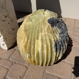 Yellow onyx barrel cactus fountain with a contrasting dark gray natural patch on one side