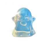 Rare Earth Gallery opalite ghost carving with a translucent blue and white finish for Halloween decor.