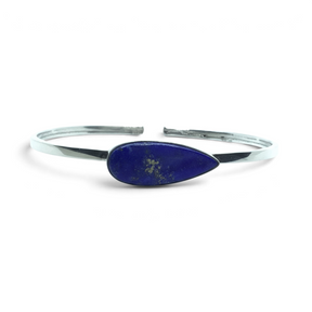 Rare Earth Gallery lapis lazuli twist bracelet featuring an east-west set pear cabochon in 925 sterling silver