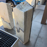 Cream banded side of the black and white onyx column fountain with a drilled top opening
