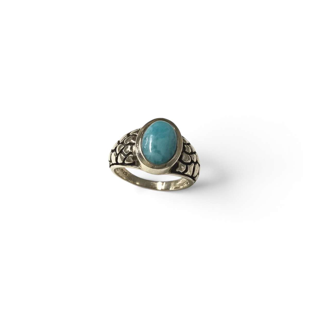Rare Earth Gallery oval larimar cabochon ring featuring an oxidized silver band with a textured scale pattern.