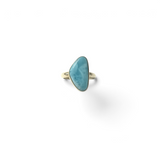 Rare Earth Gallery size 7 ring featuring a light blue freeform larimar cabochon stone set in a simple silver band.