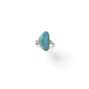 Rare Earth Gallery size 7 ring featuring a light blue freeform larimar cabochon stone set in a simple silver band.