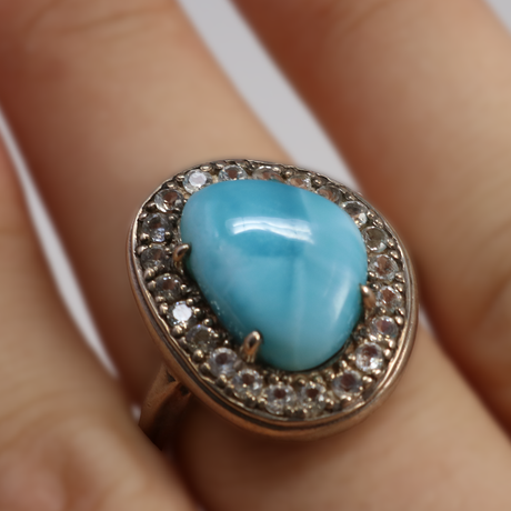 View of Larimar Ring - Freeform Prong Set Cabochon With White Topaz Bezel Sz10