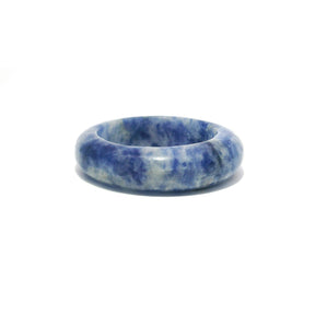 Sodalite gemstone band ring in mottled blue and white, carved from solid stone