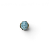 Rare Earth Gallery oval larimar cabochon ring with a silver braided bezel and gold heart detail on an oxidized band.
