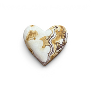 Rare Earth Gallery heart-shaped wonderstone featuring intricate brown and cream banding on a smooth polished surface