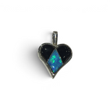 Rare Earth Gallery heart pendant featuring black onyx and blue opal inlay in a delicate silver setting.