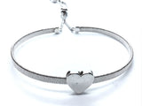 White gold plated mesh bracelet with polished heart centerpiece, adjustable