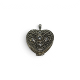 Rare Earth Gallery sterling silver heart locket featuring intricate beaded filigree and floral embossed details.
