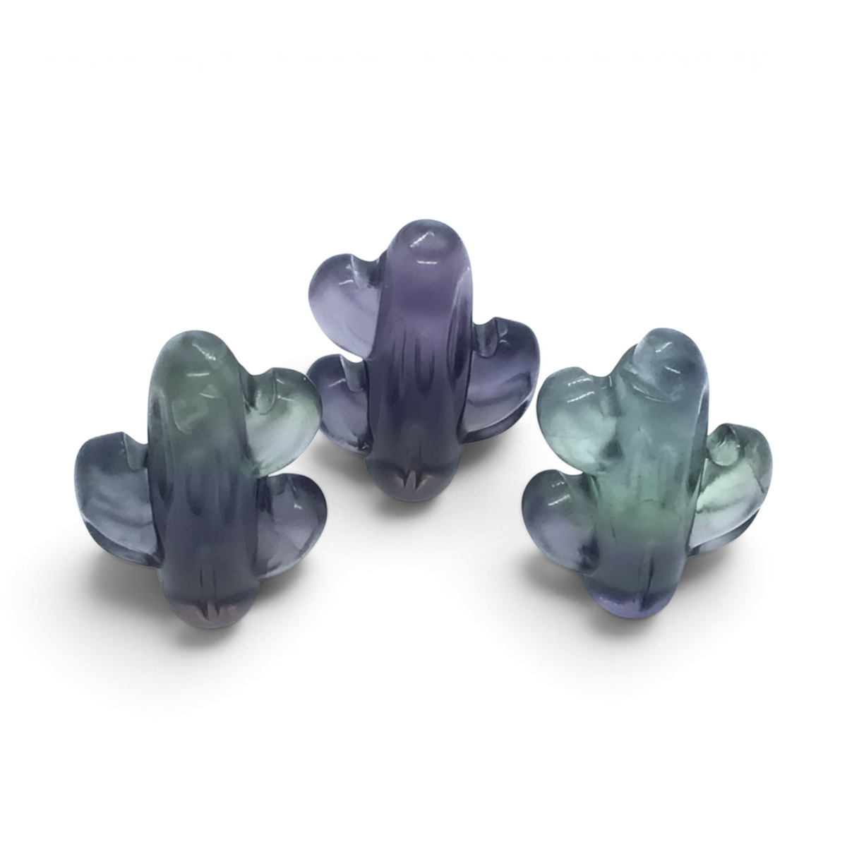 Rare Earth Gallery purple and green fluorite cactus carvings featuring polished natural crystal stone textures