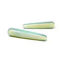 Two opalite massage wands, translucent milky white with a blue glow