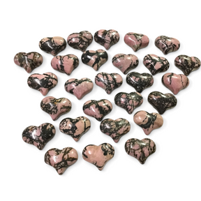 Rare Earth Gallery collection of polished pink and black rhodonite heart-shaped crystals on a white background