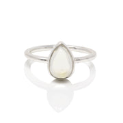 Pear-shaped rainbow moonstone cabochon bezel-set on slim sterling silver band, front view