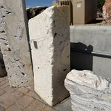 Side profile of the white fossil onyx rectangle column showing its slab thickness and pitted fossil texture