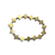 Rare Earth Gallery gold-coated Muonionalusta meteorite trefoil bracelet with polished 925 sterling silver spacers.