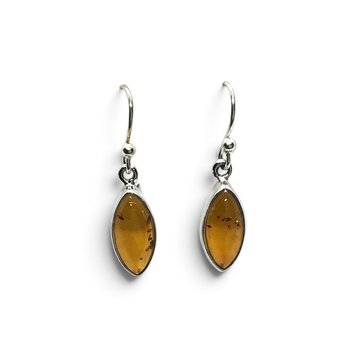 Rare Earth Gallery cognac amber dangle earrings featuring sharp oval cabochons set in 925 sterling silver bezels.