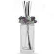 Crystal scent diffuser front view, clear bottle capped with green and purple fluorite and reeds