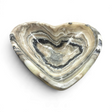 Rare Earth Gallery heart-shaped vessel carved from yellow zebra onyx with natural banded stone patterns.