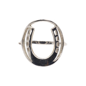 Sterling silver horseshoe ring with an open design and detailed edges, showcasing a polished finish.