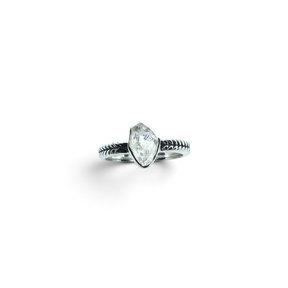 Rare Earth Gallery sterling silver ring featuring a raw Herkimer diamond in a bezel setting with a chevron band.