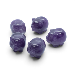 Rare Earth Gallery set of five polished chevron amethyst mini pig carvings on a white background