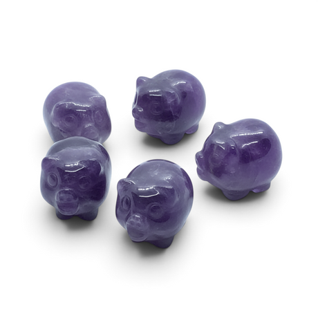 Rare Earth Gallery set of five polished chevron amethyst mini pig carvings on a white background