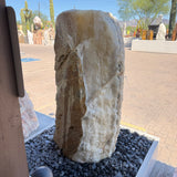 White crystal and gray onyx band fountain showing its brown travertine side against the white crystal face