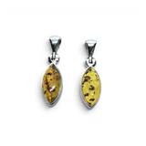 Rare Earth Gallery cognac amber pendant featuring a sharp oval cabochon set in a simple sterling silver bezel