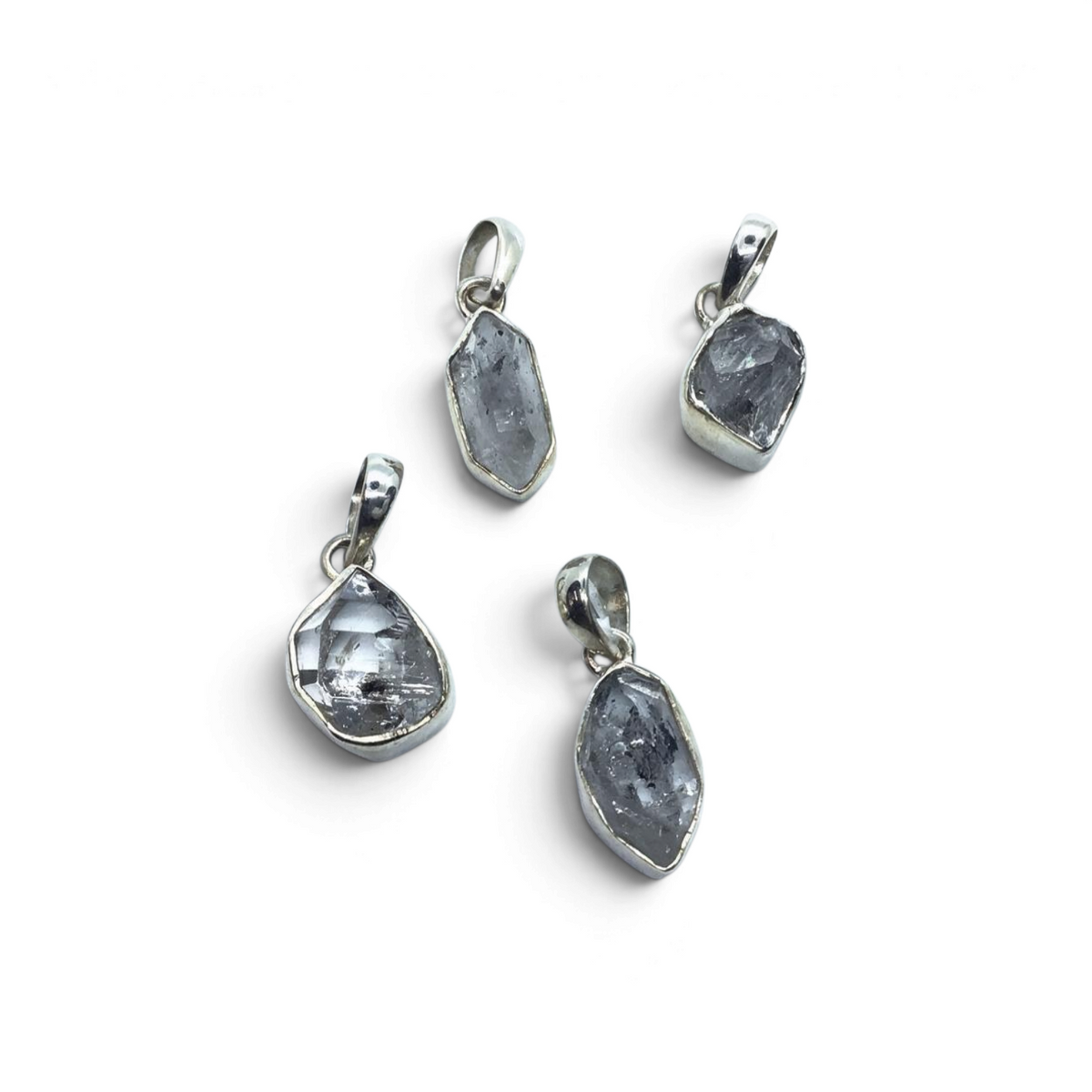 Rare Earth Gallery bezel set Herkimer diamond pendants featuring clear double-terminated quartz crystals in silver