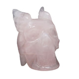 Rose quartz skull with wings carving, opposite side view of feathered wings