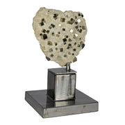 Dozens of single pyrite cubes studding a cream matrix slab mounted upright on a steel spinning stand