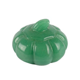 Carved green aventurine pumpkin with ribbed body and curved stem in a polished finish