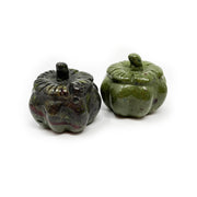 Two dragon bloodstone pumpkin carvings in mottled green and dark tones
