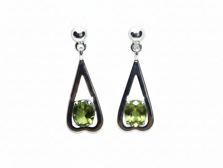 Rare Earth Gallery peridot dangle earrings featuring faceted oval stones in sterling silver reverse heart settings.