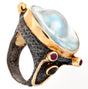 View of Mabe (Blister) Pearl Ring - With 4 Faceted Ruby Rounds & 2 Faceted Green Tourmaline Rounds Set On Oxidized Silver Hammered Band With Gold Vermeil Accents Sz8.5