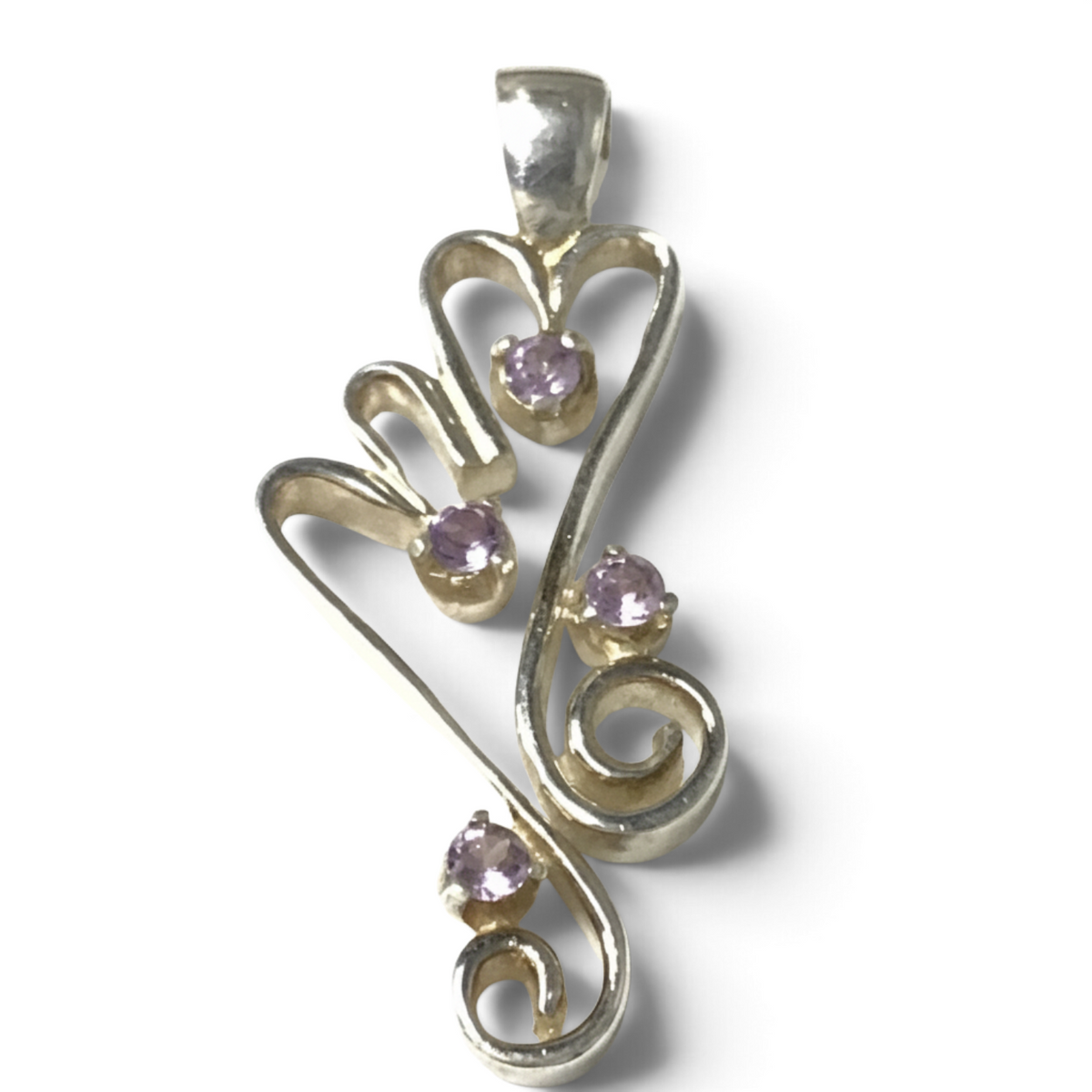 Rare Earth Gallery faceted amethyst pendant featuring four round purple stones set in double silver hearts and spirals