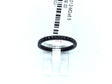 Thin black titanium band set with a row of black cubic zirconia halfway around