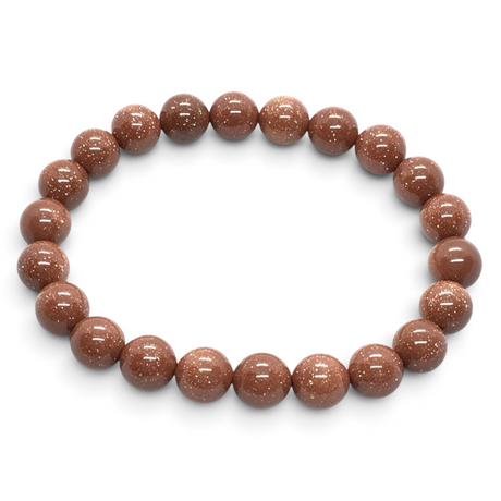 Rare Earth Gallery 8mm round red goldstone beaded bracelet with a polished, glittering finish on an elastic cord.