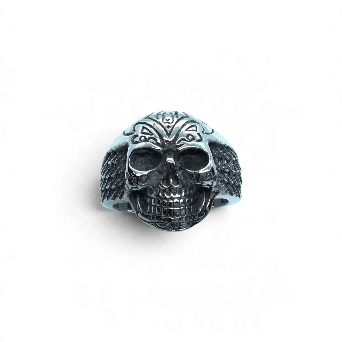 Rare Earth Gallery stainless steel skull ring featuring detailed wings and intricate engraved patterns