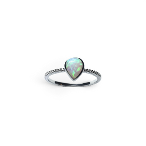 Rare Earth Gallery pear-shaped white opal ring featuring a delicate textured band on a white background.