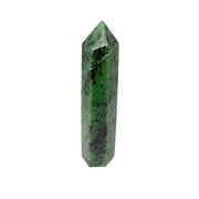 Polished ruby zoisite point in green zoisite with black hornblende specks and pink ruby patches