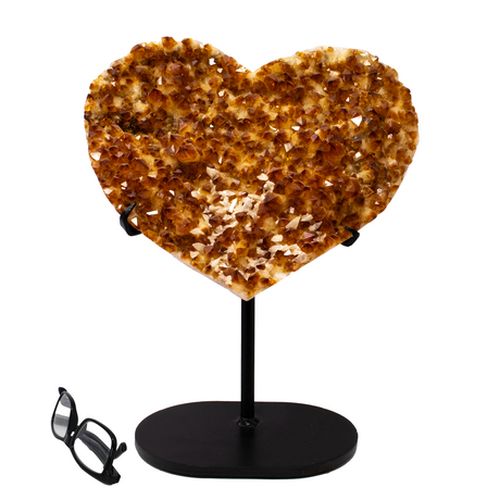 View of Citrine Crystal Heart On Fitted Stand With Small Calcite Crystal Cluster Inclusions At Tip