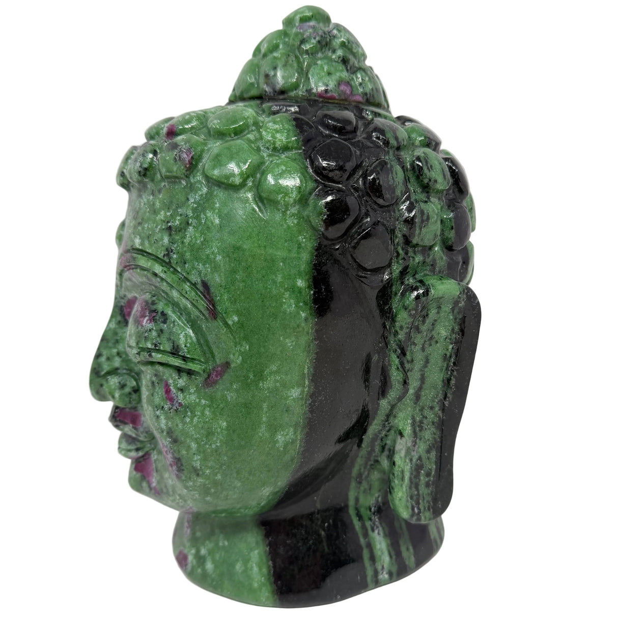 Green stone Buddha head sculpture on a white background