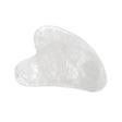 Clear quartz gua sha facial tool, translucent crystal heart-shaped stone