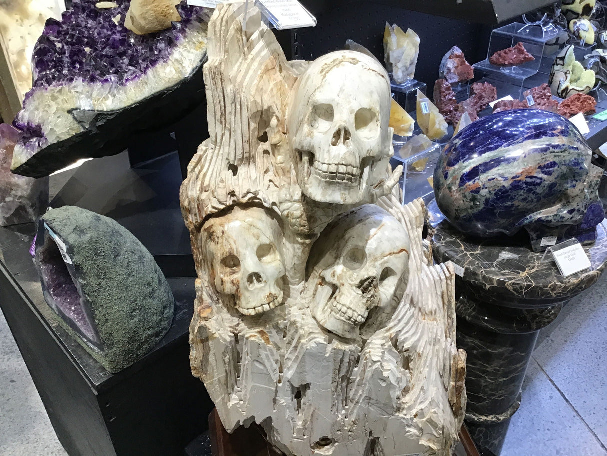 Hand-Carved Petrified Wood Skull Trio In Custom Swivel Base