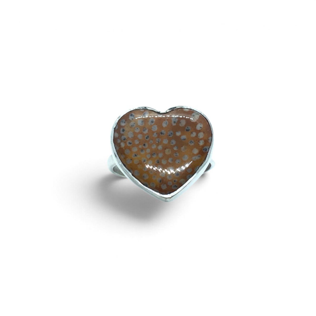 Rare Earth Gallery heart-shaped fawn jasper ring with burnt sienna and orange tones in a simple silver bezel setting.