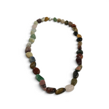 Rare Earth Gallery necklace featuring a variety of polished, multi-colored tumbled gemstones on a silver clasp.